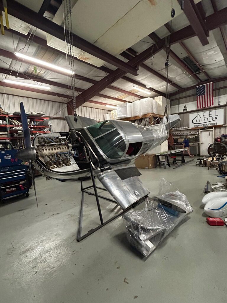 1948 Swift aircraft mounted on custom fixture for overseas shipment